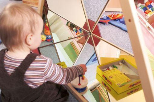HABA Pro Large Mirror Triangle House, a children's mirrored play structure with a triangular house shape and multiple mirrored panels for interactive play and exploration.