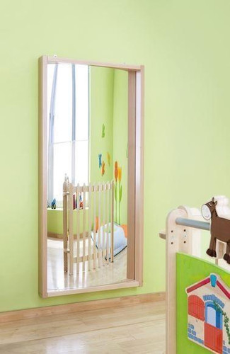 HABA Pro Convex Fun House Curved Mirror, colorful kids' room decor with a large curved mirror on the wall.