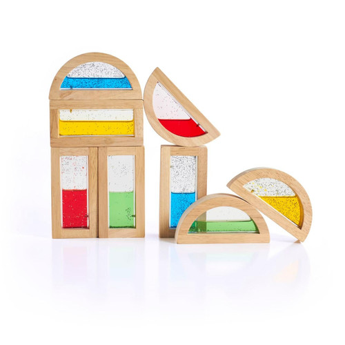 Guidecraft Shimmering Water Rainbow Blocks, colorful wooden water blocks with transparent sections filled with shimmering liquid in various colors including red, yellow, blue, and green.