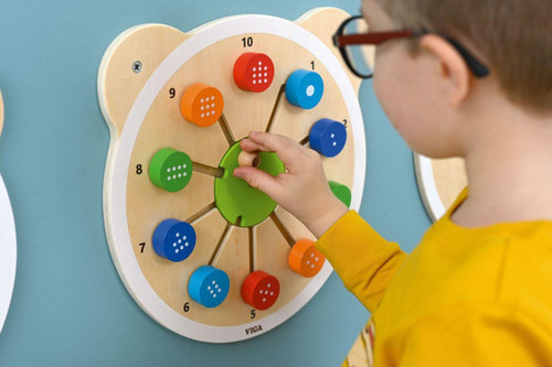 Moje Bambino Match the Numbers Sensory Wall Toy, a wooden educational wall panel with colorful numbered blocks and pegs for tactile matching activities.