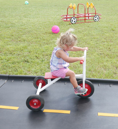 Girl Riding Infinity Tricycle