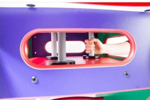 Playscapes Magnetic Wand for Playscape Activity Tables, handheld magnetic wand held by a child's hand inside a playtable with colorful structure.