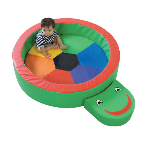 Children's Factory Turtle Hollow Soft Play Yard, colorful turtle-shaped play area with a smiling face and a child sitting inside.