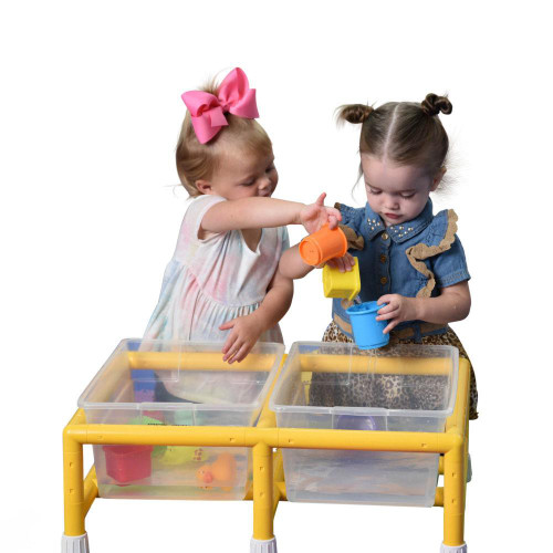 Children's Factory Mini Double Discovery Sensory Table, two young girls playing and pouring water into cups at colorful sensory play table.