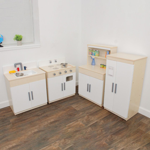 Angeles Complete Play Kitchen 4-Pieces - Assembled, miniature kitchen set with sink, stove, and storage cabinets in a bright room.