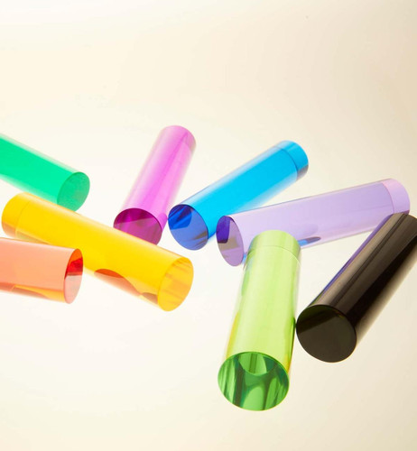 LiteZilla LitePins for Giant Light Brights, colorful transparent plastic pins in various colors scattered on a white surface.