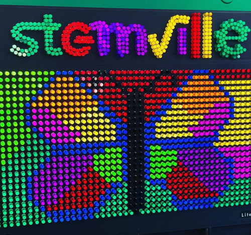LiteZilla Giant Lite Brite - 8' x 6' product, large colorful LED light display with the word 'Smile' and vibrant abstract patterns.
