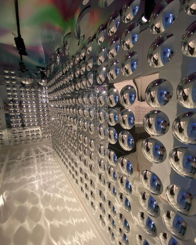 LiteZilla Sensory Bubble Mirror Panels, reflective silver bubble panels creating a dynamic, shimmering visual display with intricate light reflections and shadows.