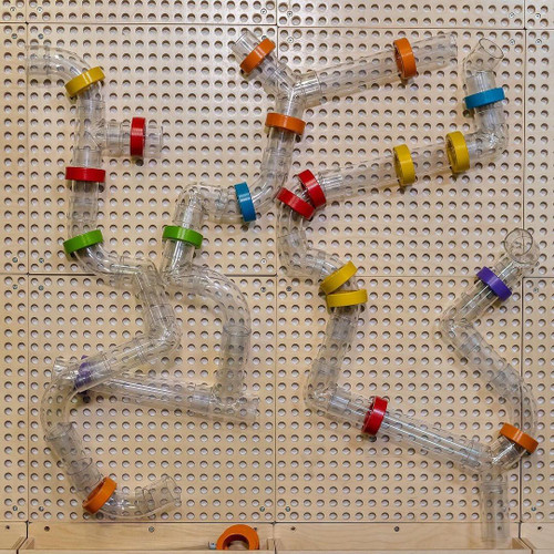 LiteZilla Kidworx Twist and Turn Tubes Wall Ball Run Bundle, colorful plastic tubes with interlocking joints arranged to form a creative ball run on a pegboard wall.