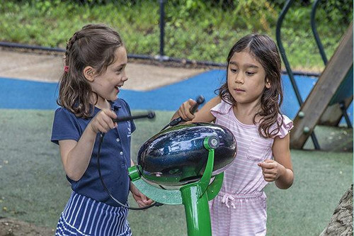 Freenotes Calypso Outdoor Tongue Drum, children playing and enjoying music with the outdoor percussion instrument in a park setting.