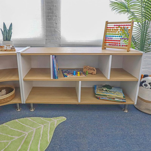 Whitney Brothers elevatED™ Storage Cabinet 27H, wooden storage unit with white frame and three open shelves, used for storing children's toys and books in a classroom or playroom setting.