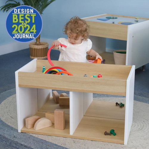 Whitney Brothers elevatED™ I-See-Me Toddler Mirrored Cabinet, child playing with colorful toy rings and wooden blocks in a children's playroom setting.