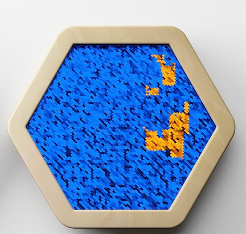 LiteZilla Multi-Sensory Hexagon Panel - Blue to Orange Sequin Flip Classic, colorful sensory panel with blue and orange sequins in a hexagonal shape