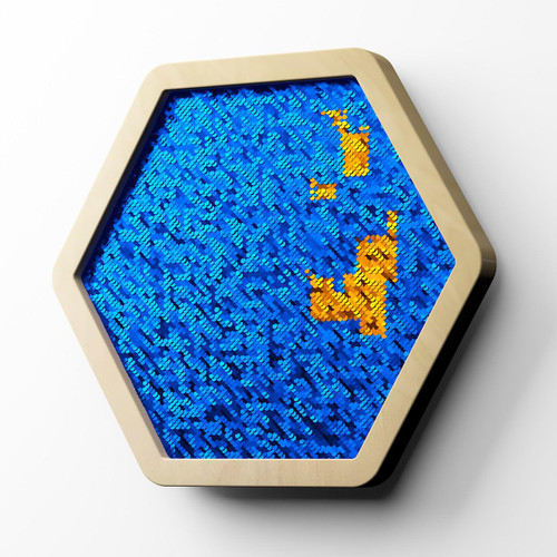 LiteZilla Multi-Sensory Hexagon Panel - Blue to Orange Sequin Flip XL, a large hexagonal sensory panel with flip sequins in blue and orange colors.
