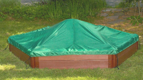 Frame It All Sandbox Tarp Cover - Hexagon, green tarp cover over a wooden sandbox in a garden setting.