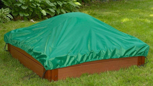 Frame It All Sandbox Tarp Cover - Square, green tarp covering a sandbox with a wooden frame, providing protection from weather and debris for children's outdoor play area.