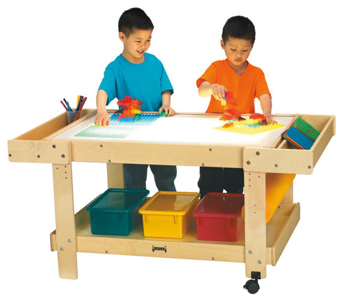 Jonti-Craft Creative Light Center with Side Caddies, a light-up activity table for children with colorful blocks and drawing supplies.