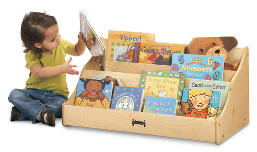 Jonti-Craft Tiny Tots Pick A Book Stand, wooden children's book display with multiple colorful children's books and a young girl reading.