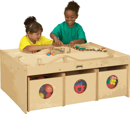 Jonti-Craft Children's Activity Table with Bins, children playing with toys and blocks on a wooden activity table with storage bins underneath.