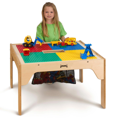 Jonti-Craft Wood DUPLO® Square Storage Table 27" x 27" with a child playing with colorful building blocks and toys on the tabletop.