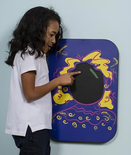 Playscapes Playsa Face Girl Heat Sensitive Wall Panel, girl touching the heat-sensitive surface of the colorful wall panel depicting a face with vibrant yellow and purple drawings.