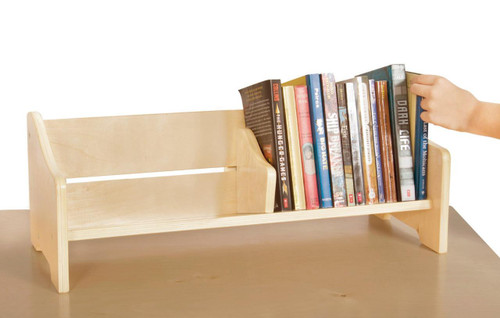 Guidecraft Tabletop Book Browser, wooden book display shelf with books and a child's hand reaching for a book