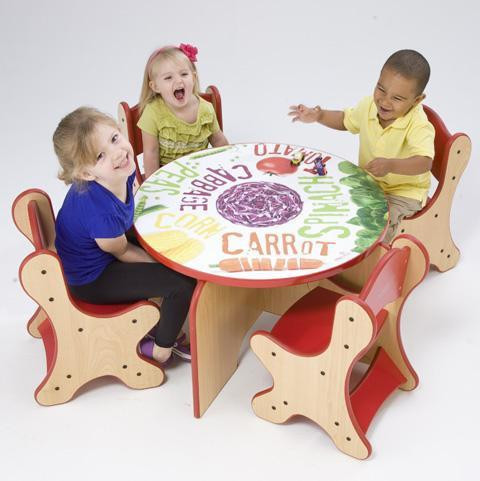 Playscapes Veggie Kids Table & Chairs Set, children's playful activity table with colorful vegetable-themed design and four matching wooden chairs with red seats.