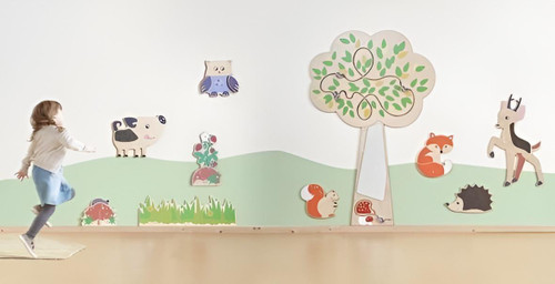 HABA Pro Tree Mirror Interactive Wall Decor, children playing near a wall decorated with a tree, animals, and interactive elements.