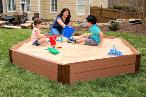 Frame It All Hexagon Sandbox with Collapsible Cover, children playing with sand toys in the outdoor sandbox.