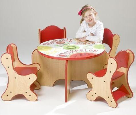 Playscapes Fresh Fruit Children's Play Table with four animal-shaped chairs and a young girl sitting at the table, ideal for children's play and learning activities.