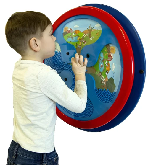 Playscapes Where is Mousy? Round Wall Toy, a young boy interacting with a colorful, circular wall-mounted educational toy for children.