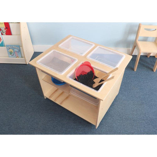 Whitney Brothers Mobile Sensory Table With Trays and Lids, educational sensory activity table with multiple transparent trays and a red scoop, on a wooden stand in a classroom setting