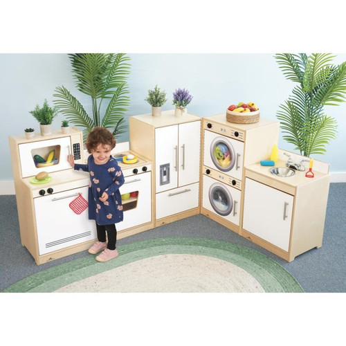 Whitney Brothers Contemporary Kid's Kitchen Set - White, a children's play kitchen with appliances, cabinets, and accessories, with a child playing in a colorful play area.