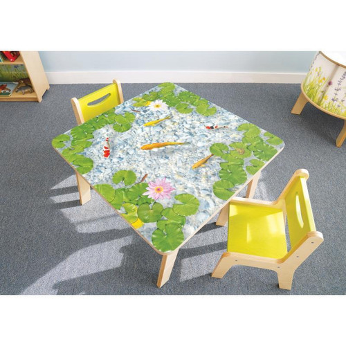 Whitney Brothers Nature View Pond Children's Table, children's table with pond-themed tabletop featuring lily pads, fish, and lily flowers, surrounded by two yellow child's chairs.