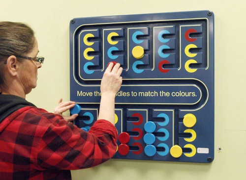 Playscapes Spindle Match Large Ambient Activity Wall Panel, children matching colorful spindle pieces on a large educational wall activity board.