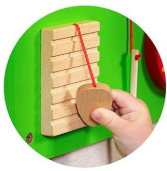 SPARK & WOW Percussion Wooden Mallet, hand holding a wooden mallet for crocodile and elephant wall toys.