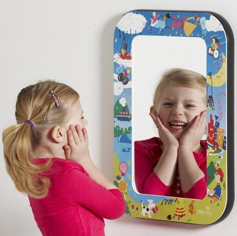 Playscapes Harmony Park Kids Mirror, including a young girl looking at her reflection with hands on cheeks.