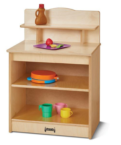 Jonti-Craft Toddler Kitchen Cupboard, wooden play kitchen storage unit with shelves and a back panel, filled with colorful toy food and dishware.