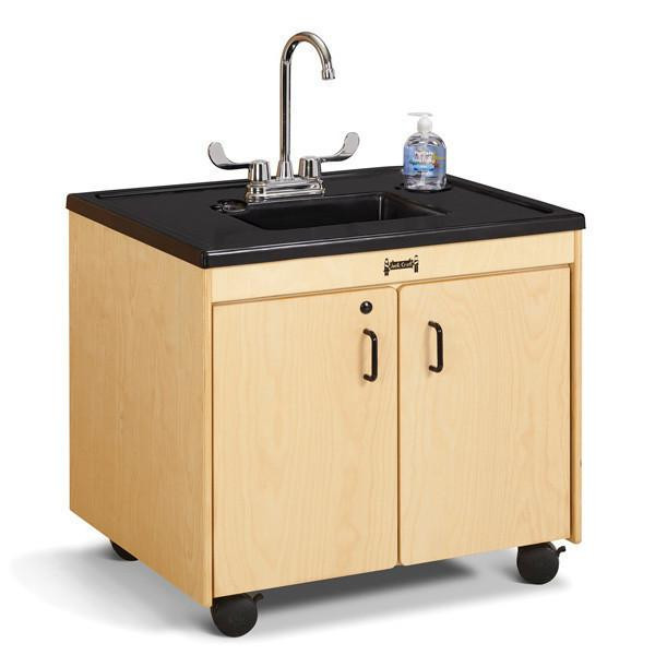 Jonti-Craft Clean Hands Helper Portable Plastic Sink - 26" Counter, wooden cabinet with black countertop, faucet, soap dispenser, and wheels for mobility.