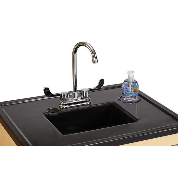 Jonti-Craft Clean Hands Helper Plastic Sink without Heater on a 38-inch counter, featuring a stainless steel faucet and a bottle of hand sanitizer.