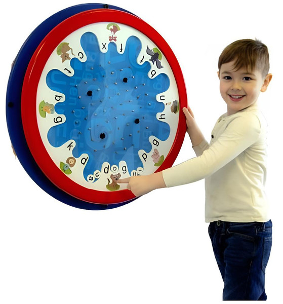 Playscapes C-V-C Word Sorter Round Wall Toy, young boy smiling and pointing at the educational word matching game on the wall.