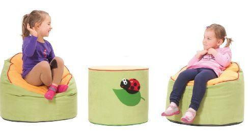 Novum Ladybug Soft Activity Table, soft green circular table with a ladybug design in the center, surrounded by two children seated on colorful bean bags, engaging in play and learning.