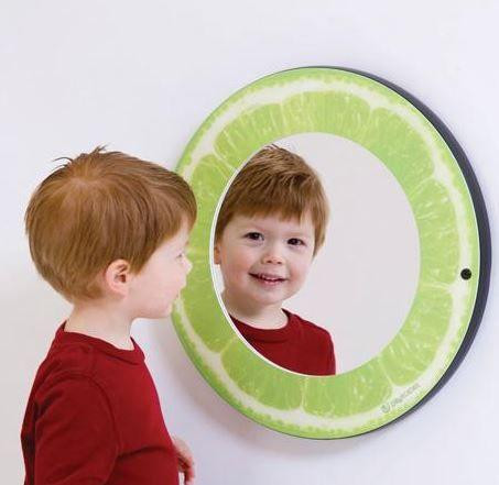 Playscapes Citrus Funhouse Mirrors - Choose from 3, child looking at a mirror designed like a lime slice, creating a fun and interactive reflection experience.