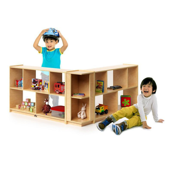 Whitney Brothers Corner Storage Cabinet 30" H, wooden children's storage unit with multiple open compartments filled with toys and books, featured alongside two smiling kids. 