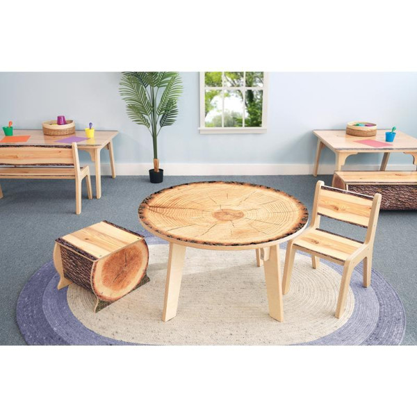 Whitney Brothers Nature View Live Edge Small Log Bench 12 inch H, showcasing a rustic round wood log bench in a playroom setting with child-sized furniture and large window.
