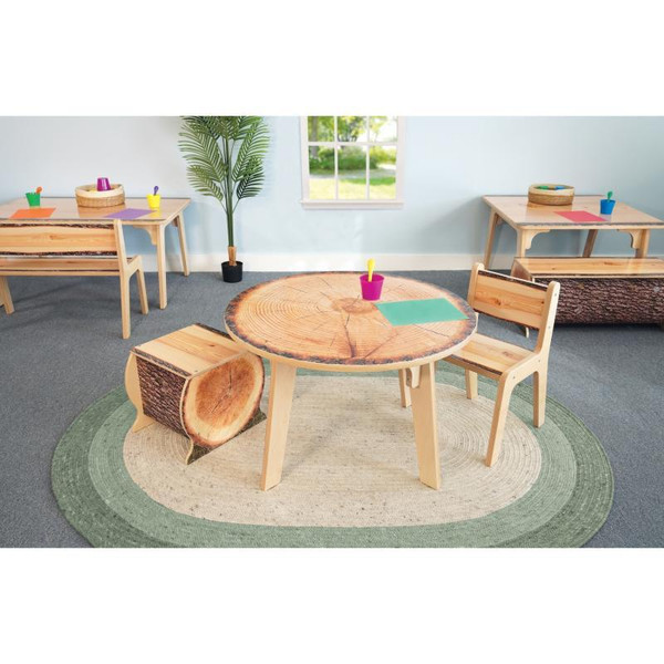 Whitney Brothers Nature View Live Edge Round Table 22' H, wooden children's table with a natural live edge top in a classroom or playroom setting.