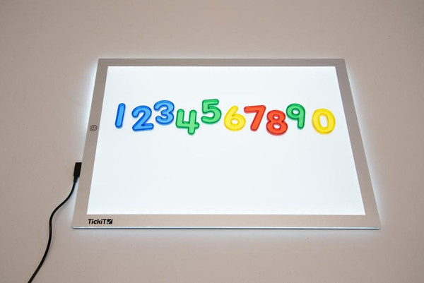 TickiT Ultra Bright LED Light Panel, illuminated white panel displaying colorful 3D number figures 1 to 0.
