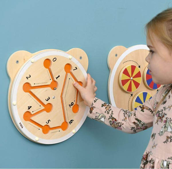 Moje Bambino Maze Sensory Wall Toy, a wooden maze clock and color spinning wheels for engaging sensory play for children.