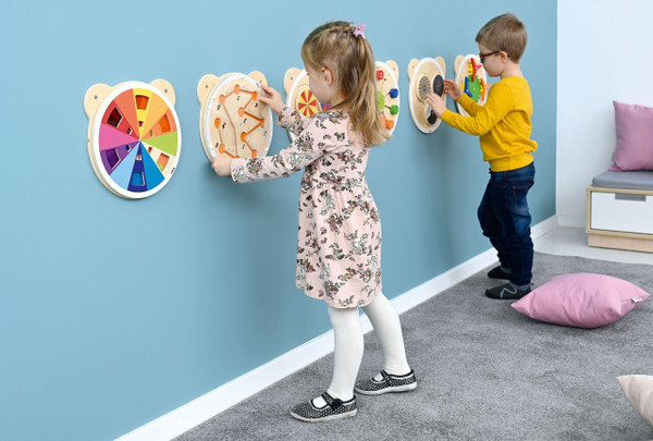 Moje Bambino Color Mix Sensory Wall Toy, children playing with colorful sensory wall panels in a playroom.