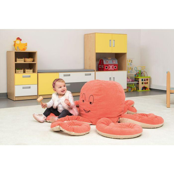 Moje Bambino Otto the Octopus Friendly Soft Seat For 6, plush octopus-shaped kids' seating with smiling face, soft pink color, and multiple tentacle seating areas, in a child-friendly playroom setting.